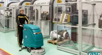 man with floor scrubber machine
